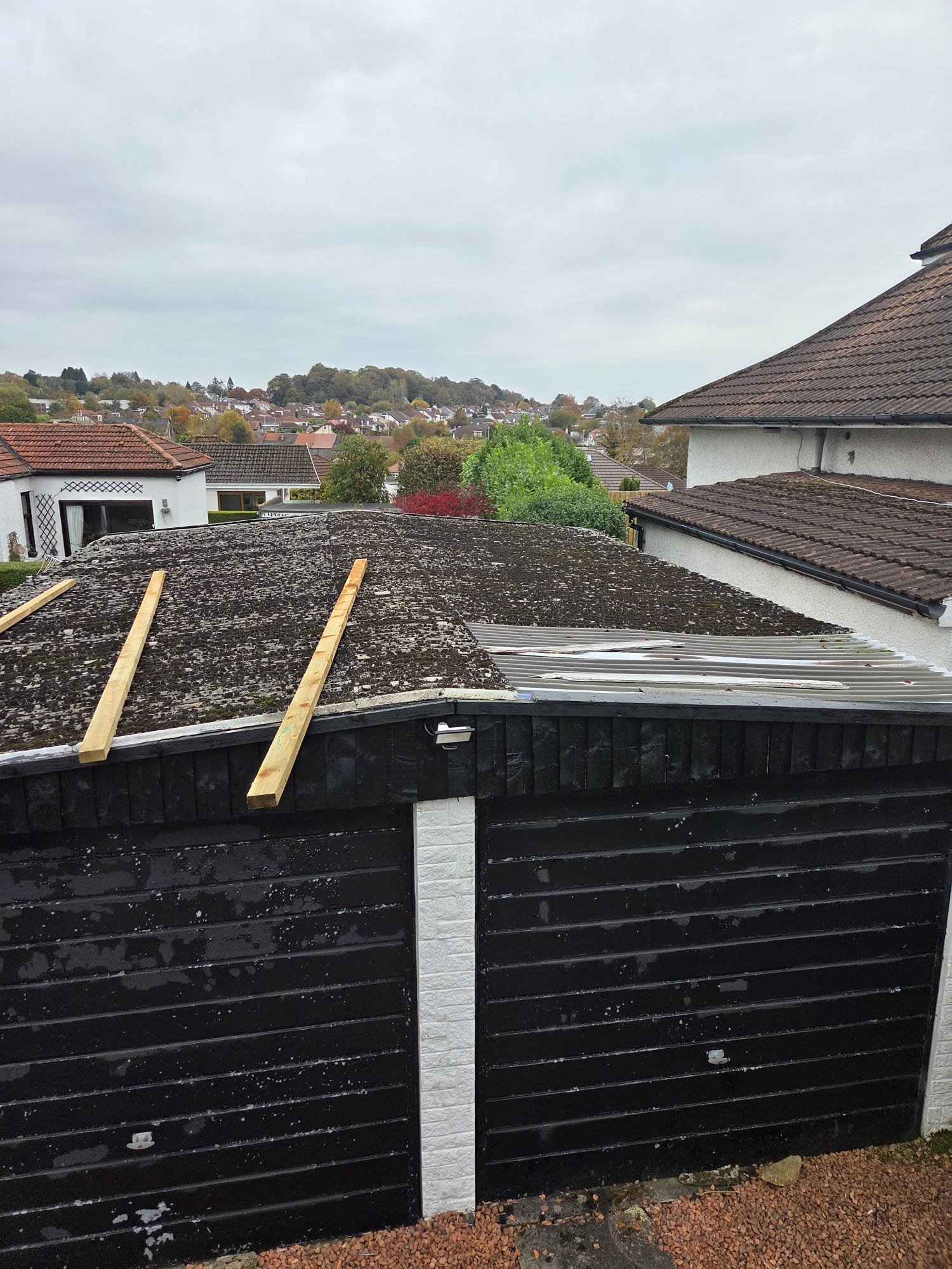 Original double garage roof with timber battens laid out before overcladding