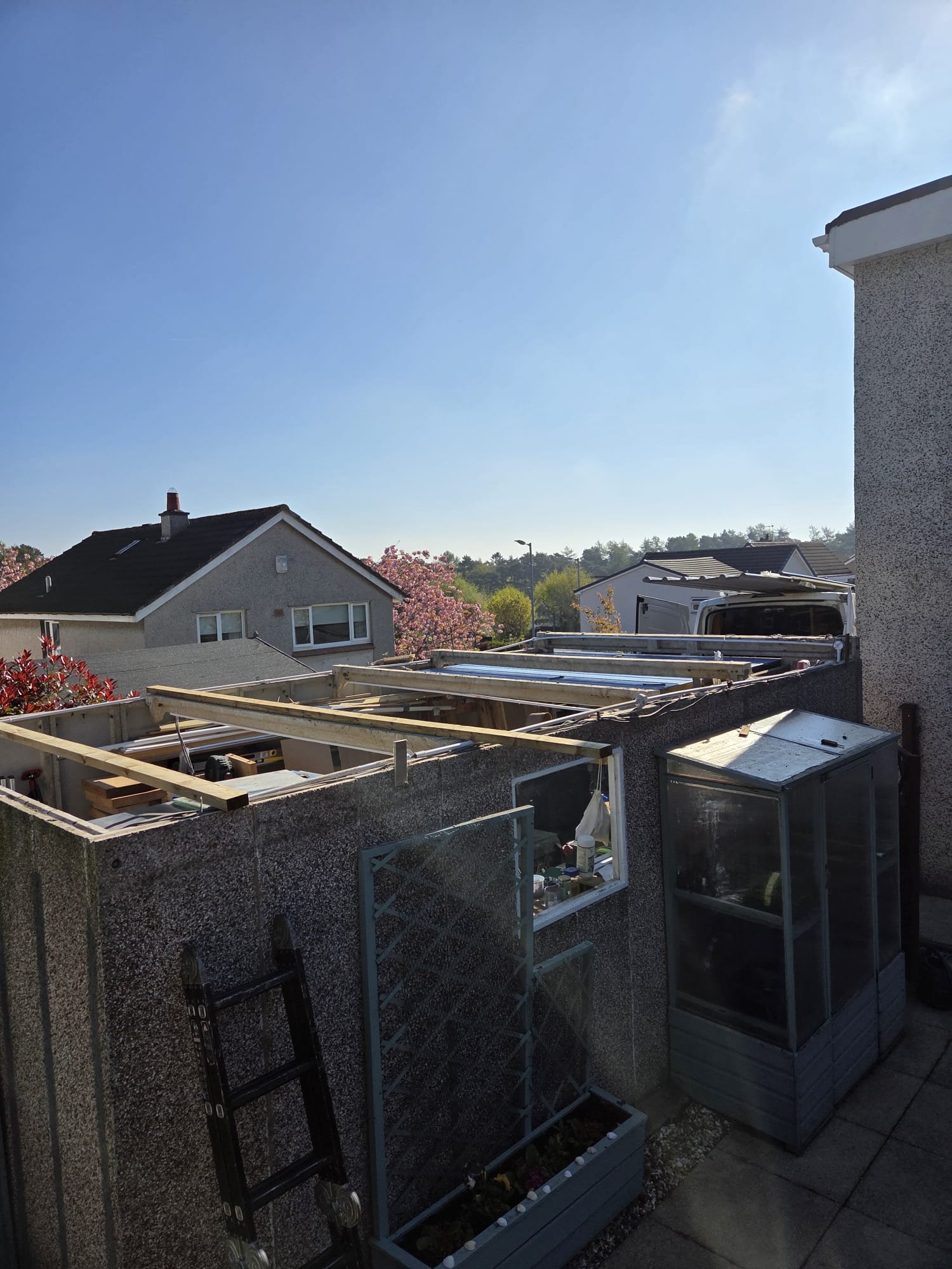 Garage roof covering removed with the supports exposed during the replacement